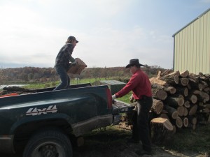 Ben and Duane unloading wood.